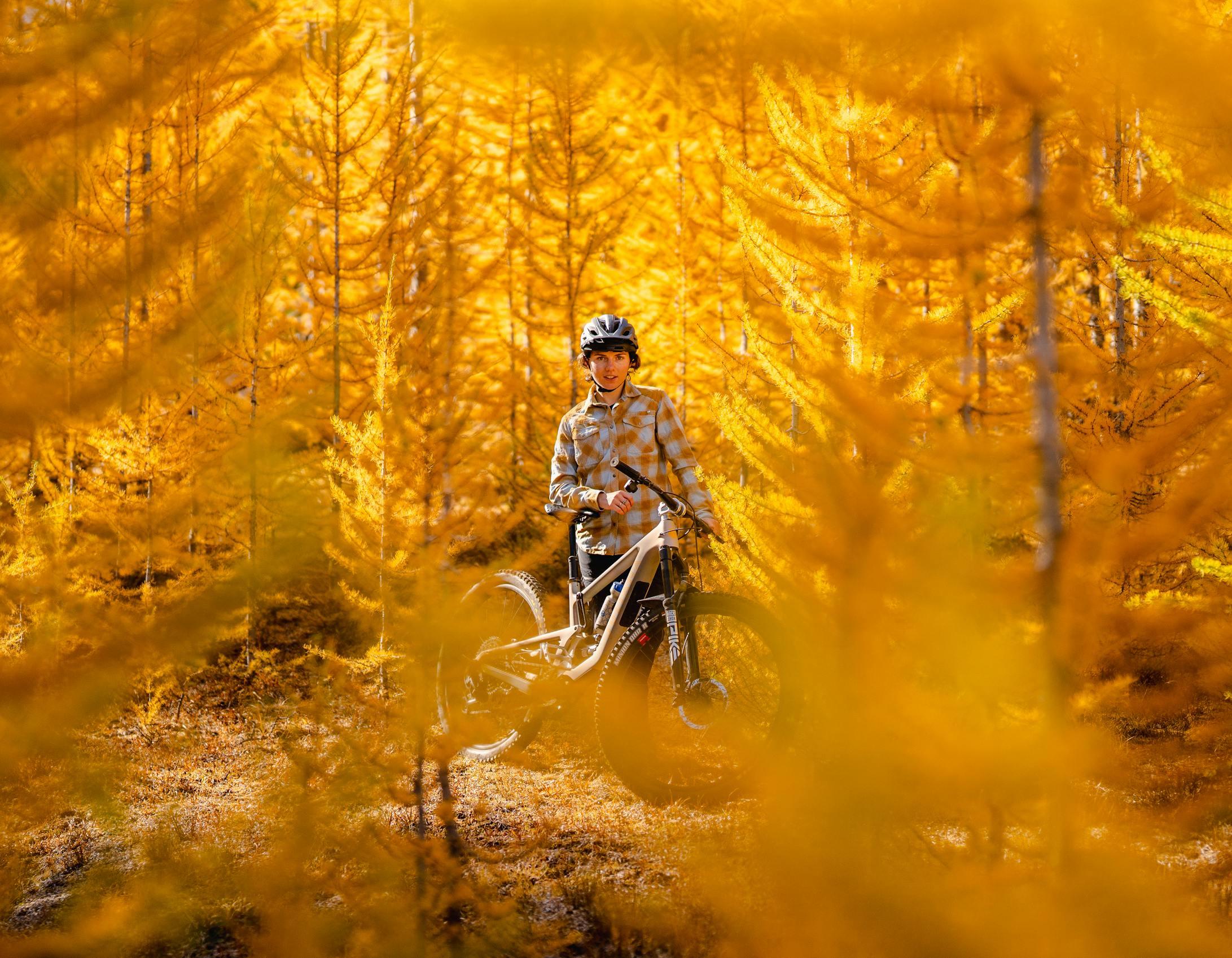 Juliana Bicycles Ambassador Delilah Cupp posing for a photo with her Juliana Furtado MX full suspension mountain bike